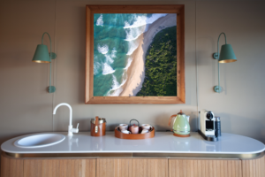 Wall art hanging above kitchen counter showing how to frame canvas prints